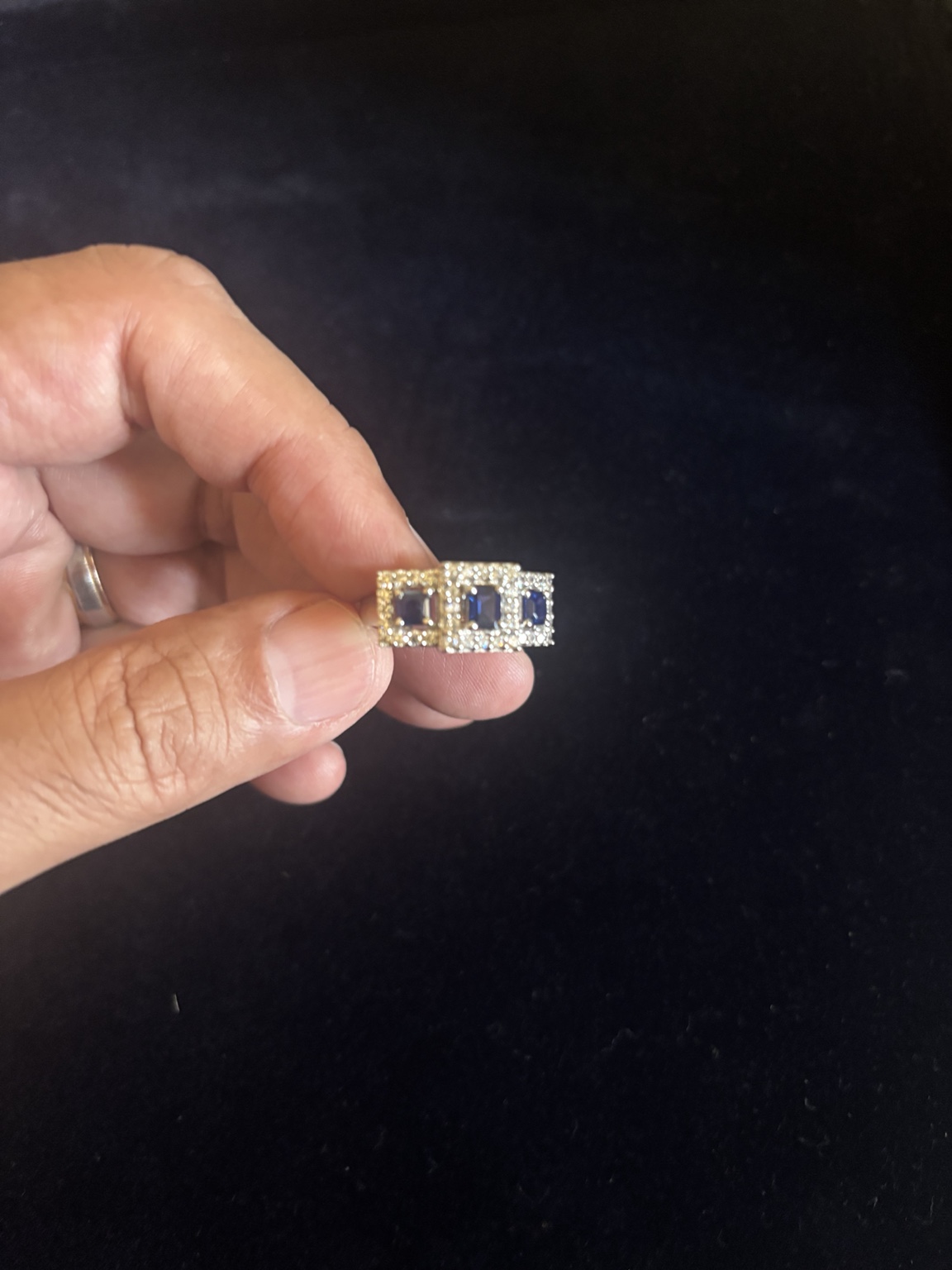 Diamond ring held in hand